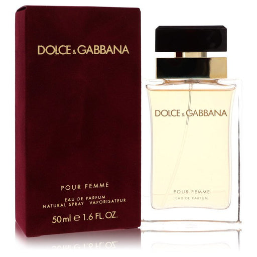 Dolce & Gabbana Pour Femme Eau De Parfum spray bottle, 1.7 oz, with elegant floral design and branding visible.