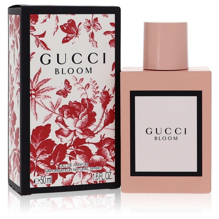 Gucci Bloom by Gucci Eau De Parfum spray for women, 1.6 oz bottle with floral design and elegant packaging.