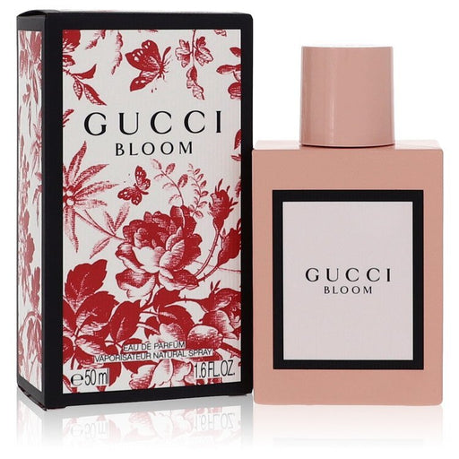 Gucci Bloom by Gucci Eau De Parfum spray for women, 1.6 oz bottle with floral design and elegant packaging.