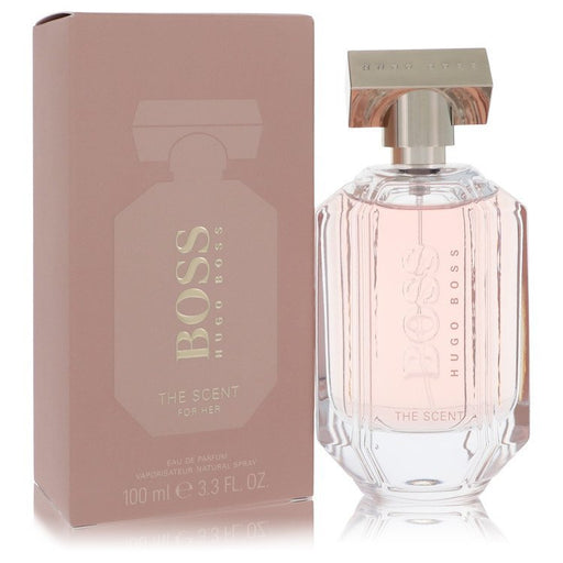 Hugo Boss The Scent women’s Eau De Parfum spray bottle, 3.3 oz, featuring elegant packaging and a luxurious fragrance design.