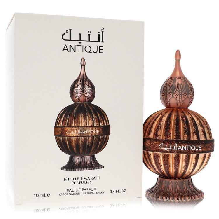 Lattafa Niche Emarati Antique Eau De Parfum spray 3.4 oz for women and unisex, elegant glass bottle with fragrance details visible.