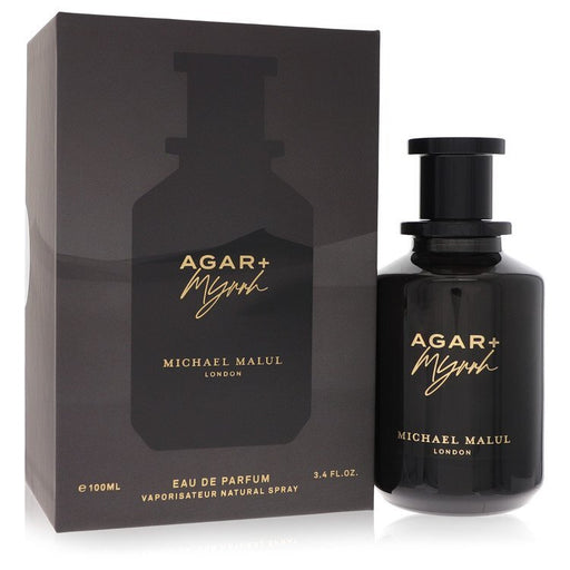 A 3.4 oz Michael Malul Agar + Myrrh Eau De Parfum spray bottle for men and unisex, featuring elegant packaging and branding.