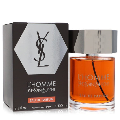 Yves Saint Laurent L'homme Eau De Parfum spray for men, 3.3 oz bottle with sleek black design and silver accents.